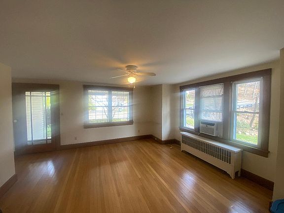 Large Living Room with Chestnut Trim and Hardwood Floors