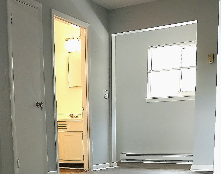 Living Room, Bathroom, Entry - more windows & natural light! Check out the new flooring!