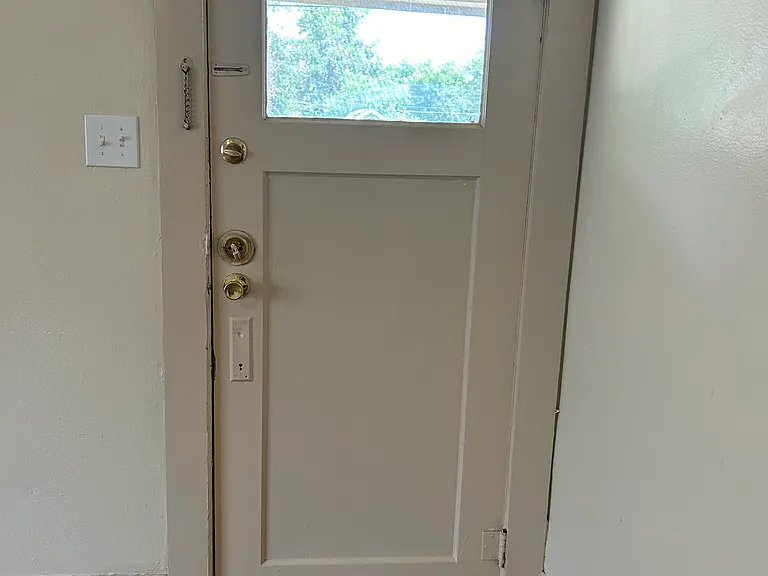 Front door. Photo taken from inside living room.