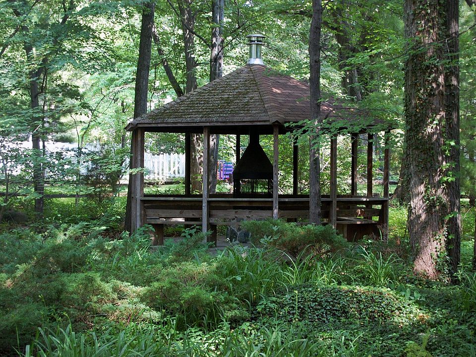 Yard is completely private with a gazebo and an outdoor fire pit.
