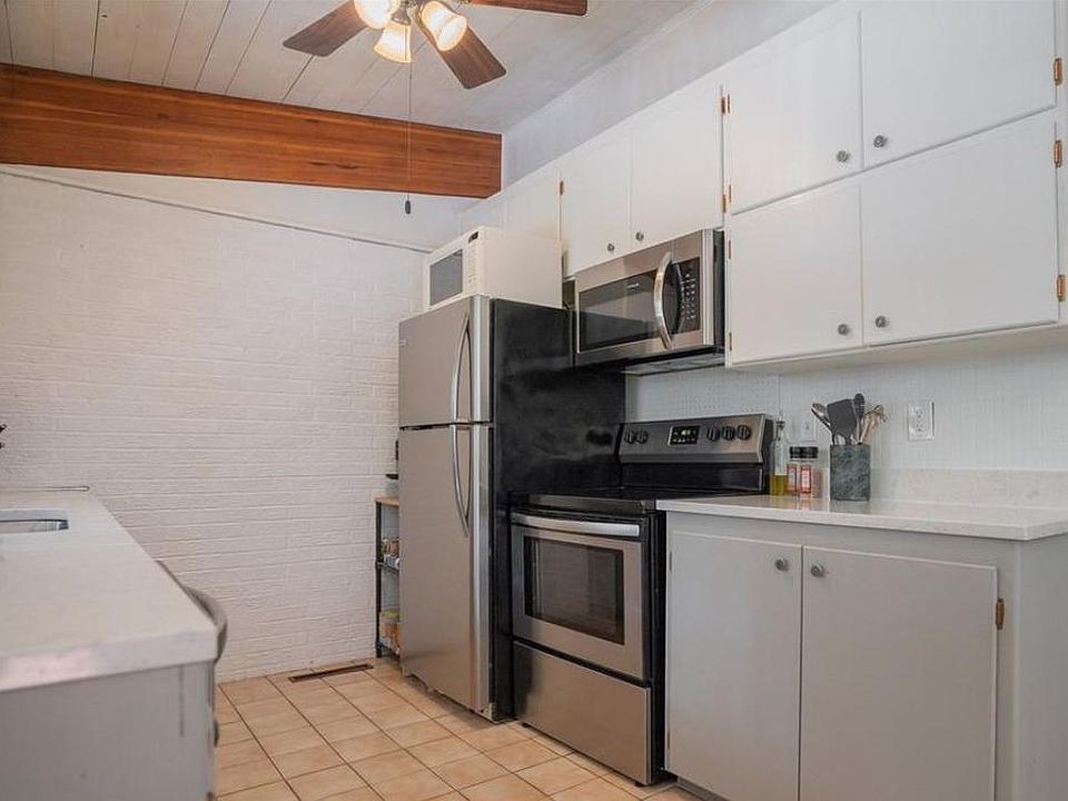 view from dining area leading to kitchen w updated appliances
