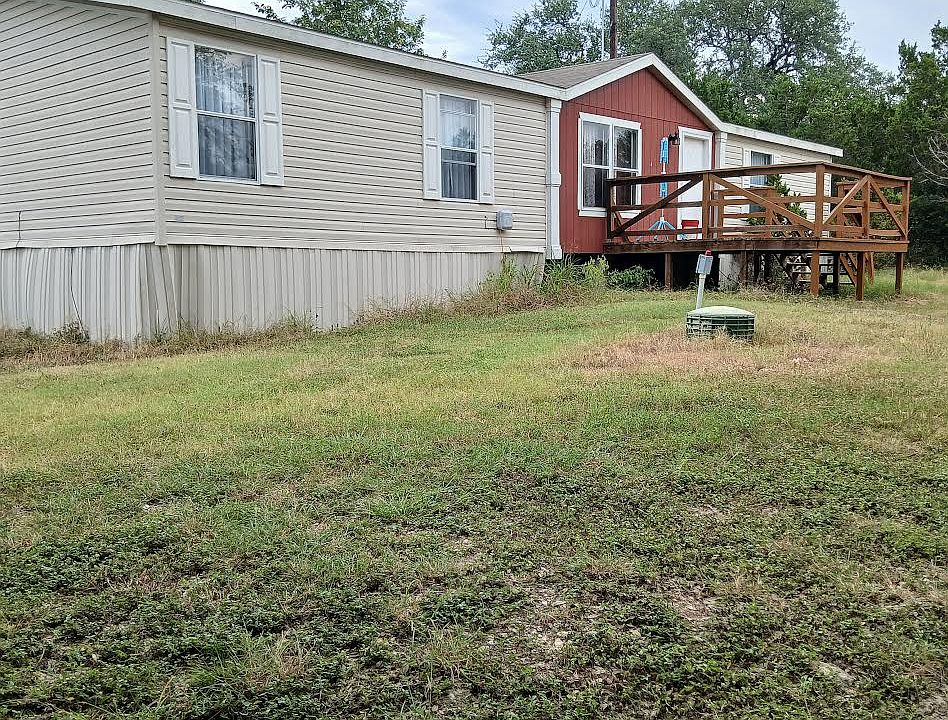 Front view of the home with a deck.