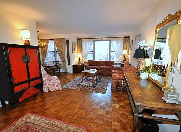 Bright and sunny large living room and "L" shaped dining room.  The living room overlooks the manicured courtyard and is 30'-2" x 12'-4" and the dining room is 9'-0" x 8'-5".