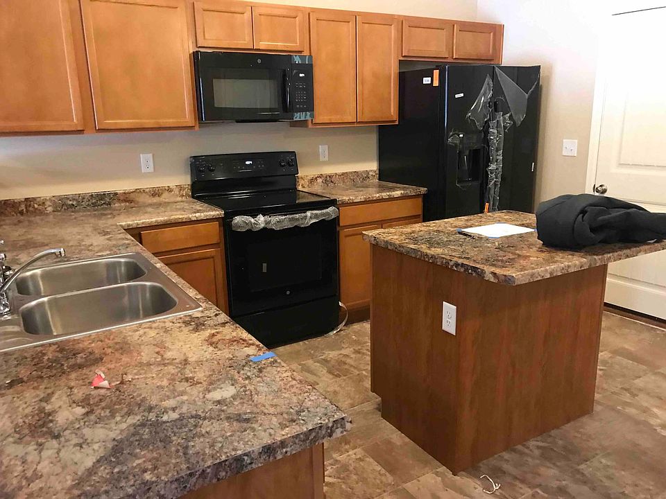kitchen with all new appliances. island where you can put 2 bar stools. great size kitchen.