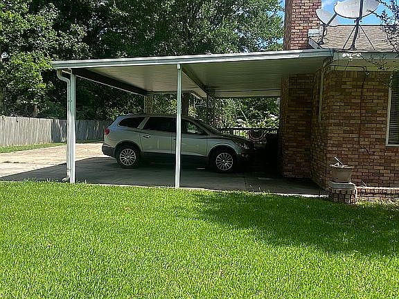 Two vehicle carport