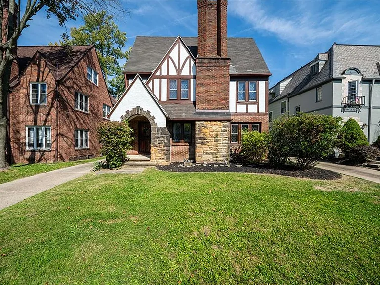 Beautiful Tudor-style multifamily home full of charm