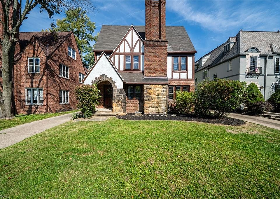 Beautiful Tudor-style multifamily home full of charm