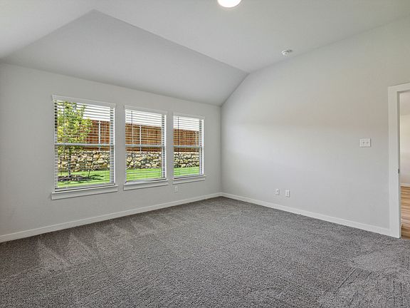 Primary bedroom in the Quartz home plan by Trophy Signature Homes - REPRESENTATIVE PHOTO