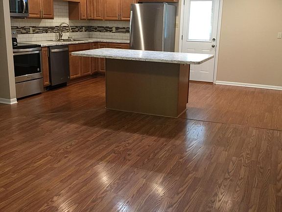 Looking at kitchen from living room, breakfast nook to right