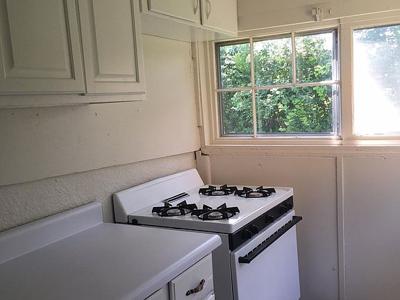 Kitchen with many windows, new track lighting