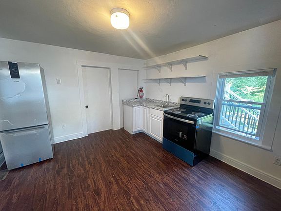 Brand new kitchen cabinets with brand new appliances_ still has the film!