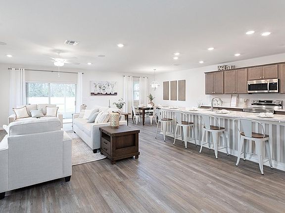 This 2-story home features a spacious open living area - Wesley II by Highland Homes