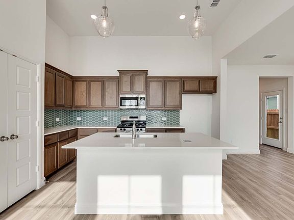 Mulberry floor plan featuring open-concept living, a breakfast area off the kitchen, and a private p