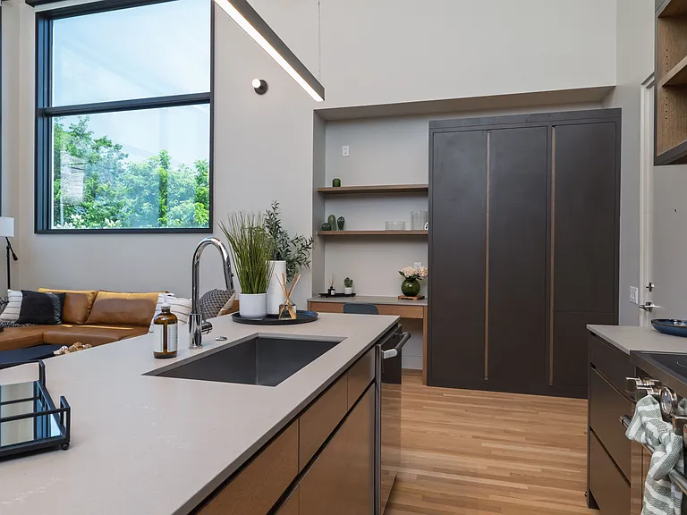 Open concept kitchen with seating for 4 at the kitchen island. The kitchen is fully stocked and ready to use.