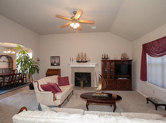 Enter the lovely Living Room with Fireplace