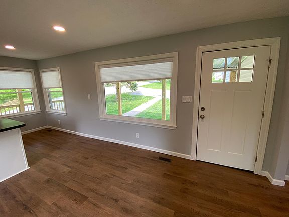 Side entry door, looking out at porch and street.