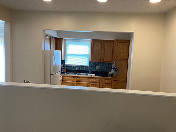 Looking from front door to foyer and Kitchen
