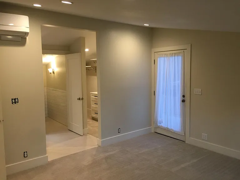 Master Bedroom looking toward door to raised deck outside