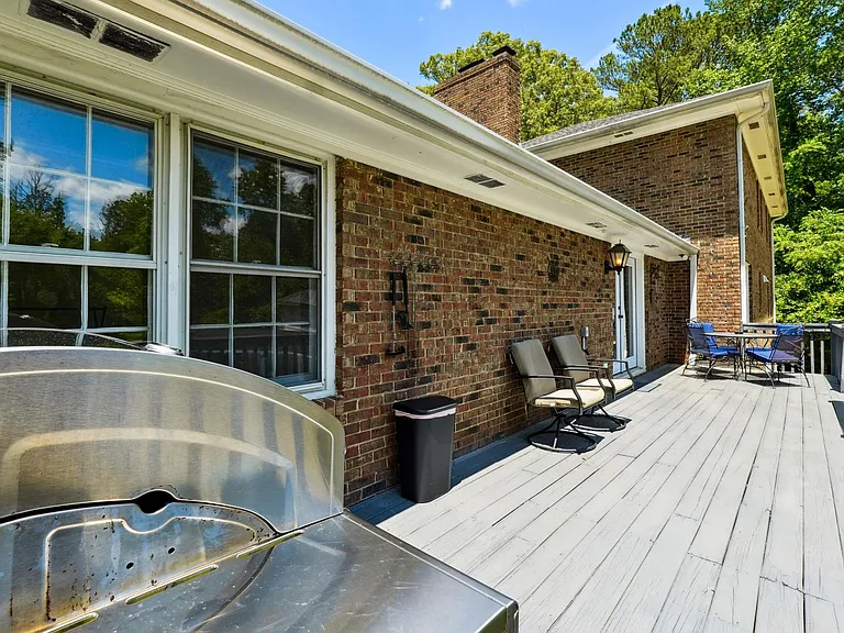 Upper back patio with outdoor furniture & BBQ gas grill off Main Level Living Room