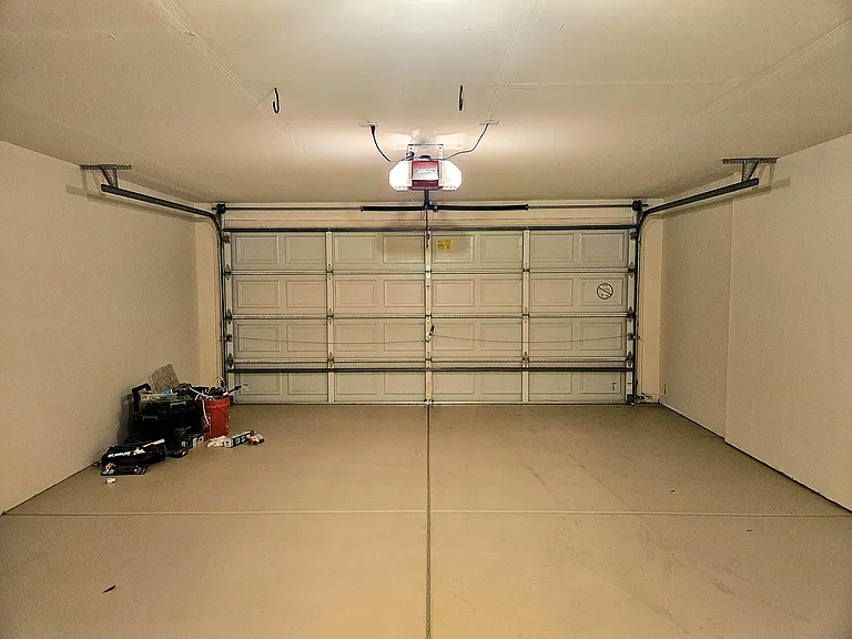 2 car side by side garage with quiet garage door opener.