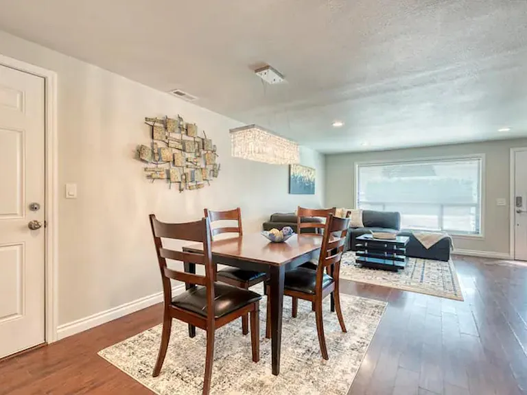 Another view of the dining area out to the living room and entry door
