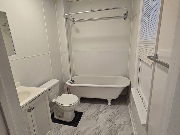 Large bathroom with new floor and beautiful clawfoot tub