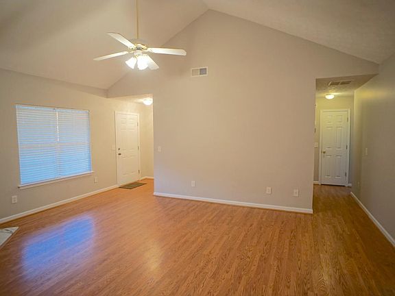 Living room with vaulted ceilings