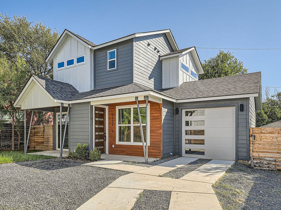 Front view with a Front yard and two outside parking spaces