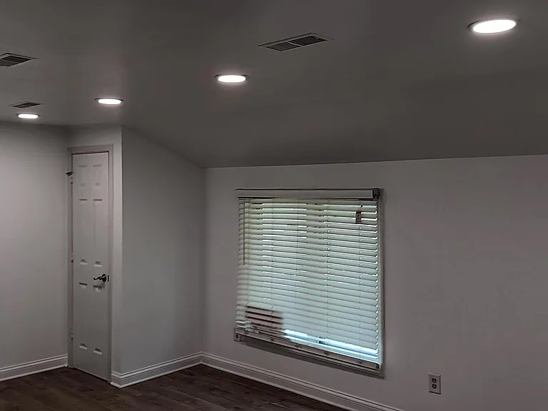 Living room: recessed lights, wood floors & blinds throughout house