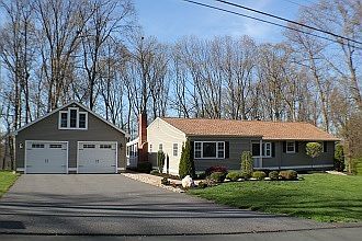Ranch : House has open floor plan. Garage has oversize doors and second floor storage.