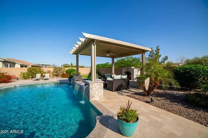 Pool depths range from 3-5-4 feet. Water features in the back of pool
