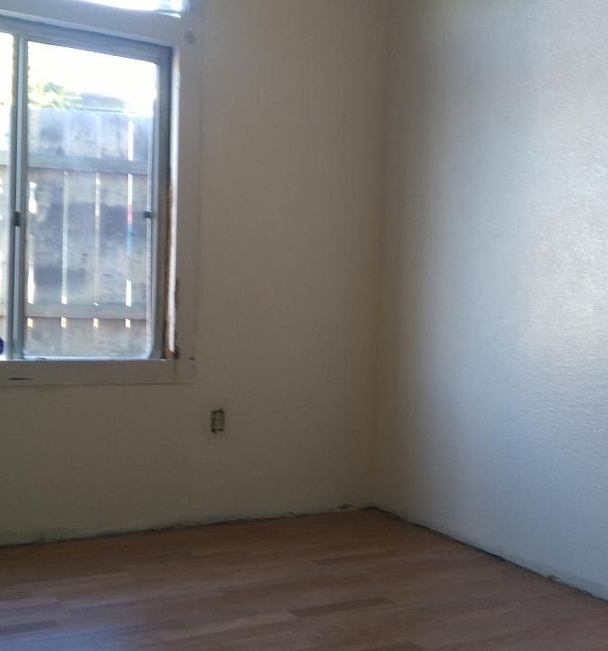 First bdrm after new laminate flooring installed