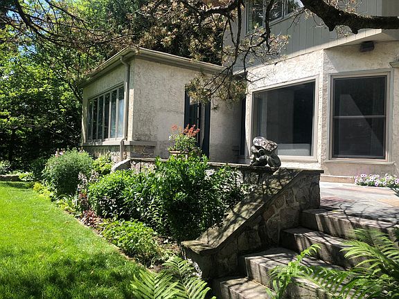 Bluestone patios and formal gardens