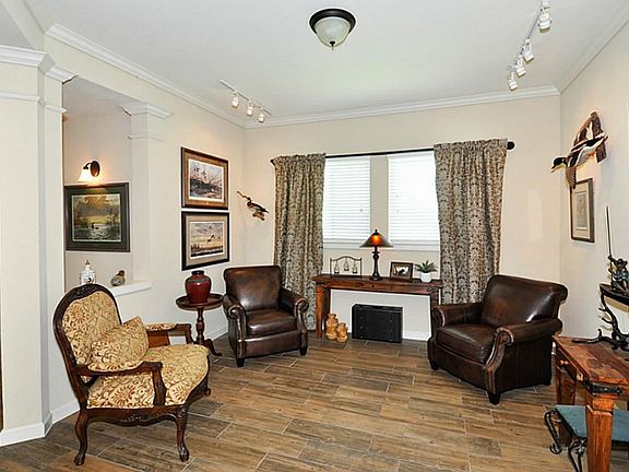 This Room can be Very Versatile, Formal living, Large Formal Dining Room, or a Office. The current owner is using it as a Sitting Room or Reading Room.