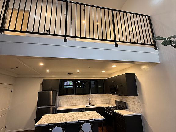 View of kitchen area and loft