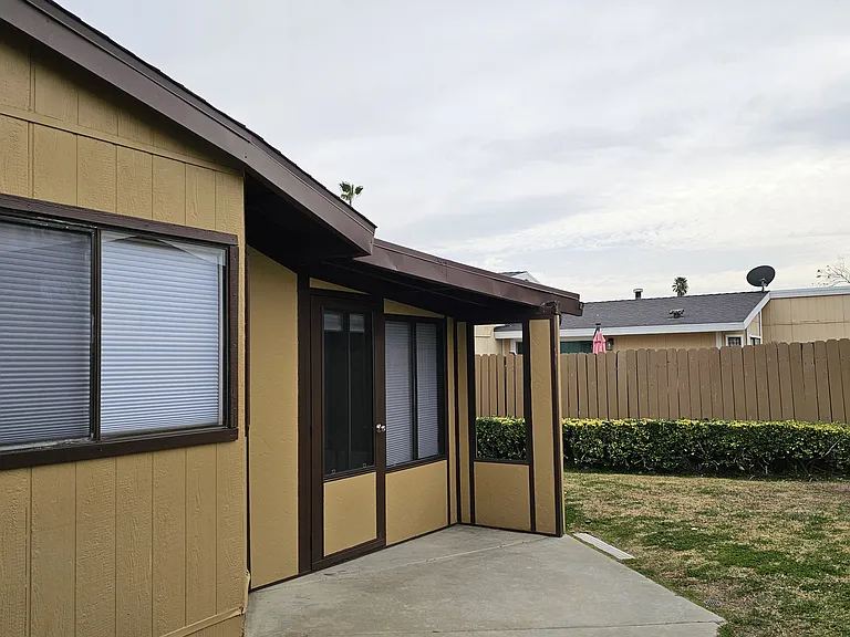 Spacious backyard with multiple points of entry from