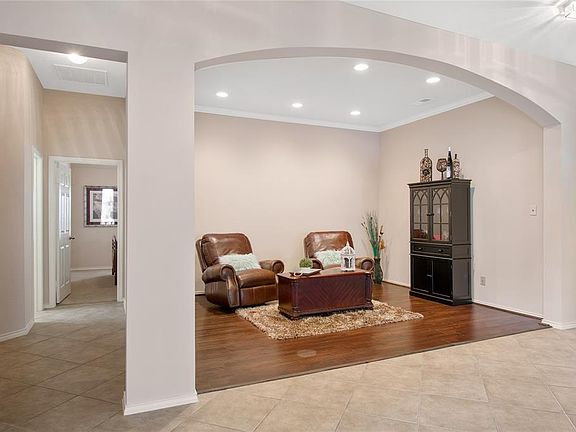 Upon entry to the home is formal living on the left and formal dining on the right. This would make a great gameroom or office space.