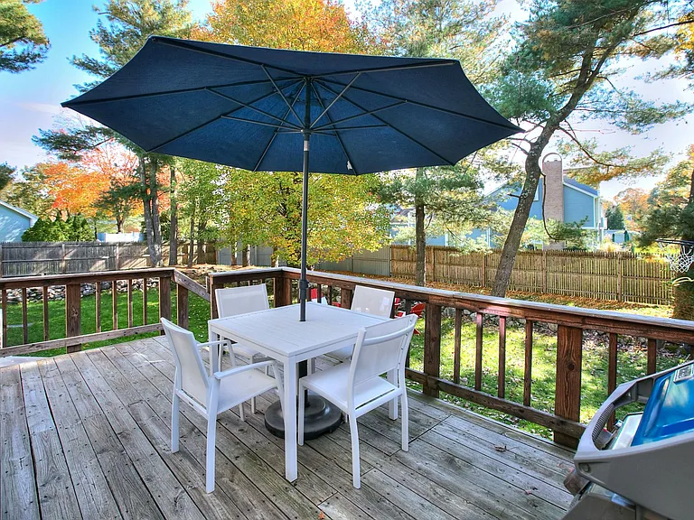 Private Backyard with deck off the kitchen. Professionally Landscaped