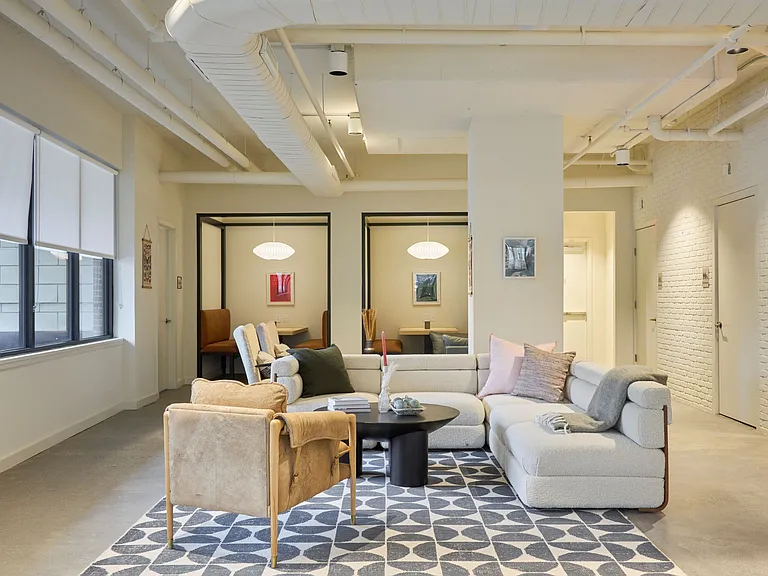 Community co-working area with private meeting rooms and offices