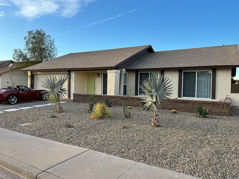 Daytime view of front of house. New garage door with wifi opener and keypad for secure entry. White stepping stones to custom painted front door complete the updated look