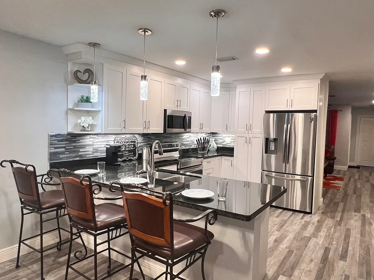 Photo 1 of 20 - 7106 NW 79th Ave #7106 - Tamarac, FL Chef kitchen with bar area seating for 3 - 7106 NW 79th Ave #7106