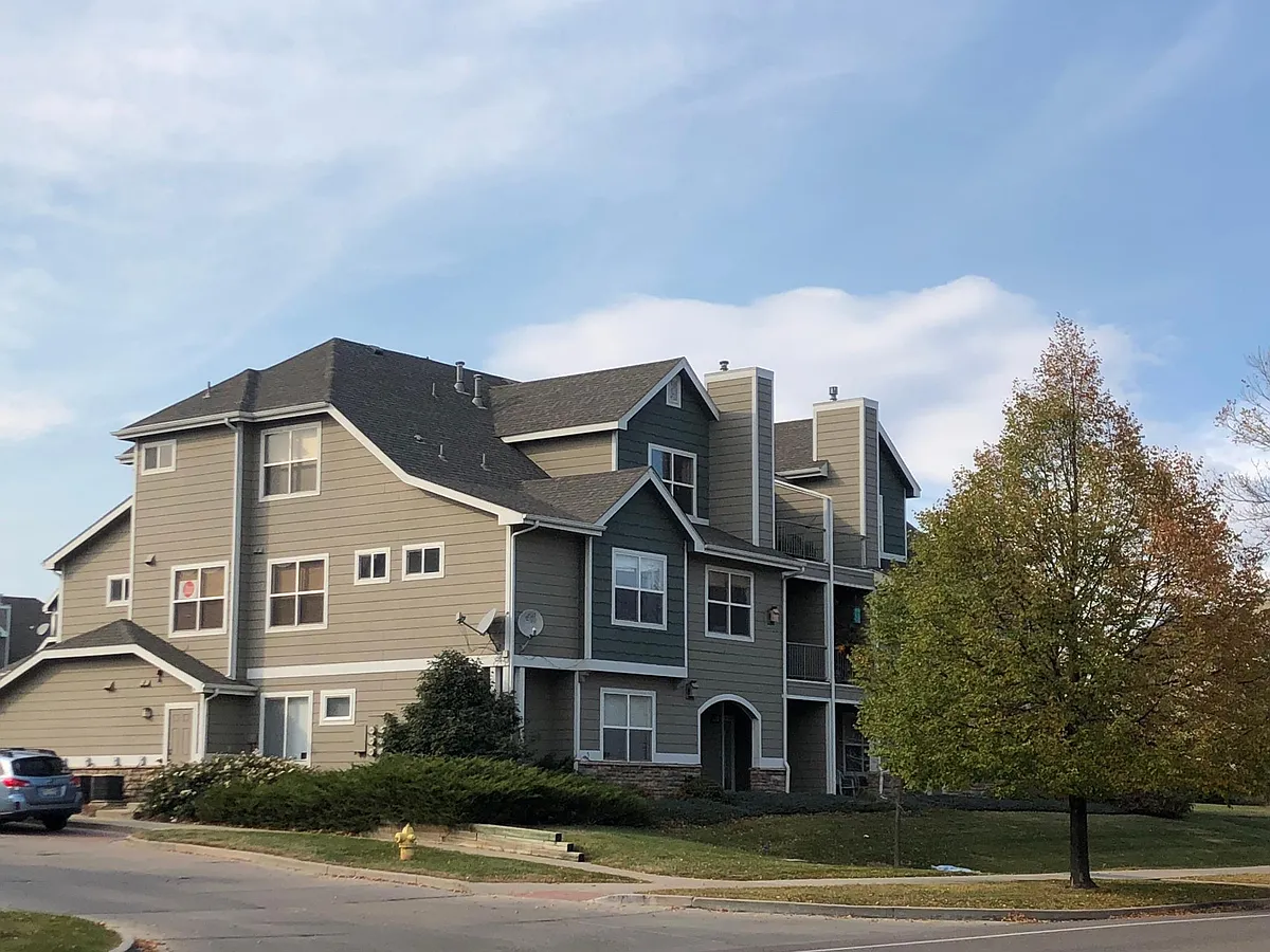 Unit F-5 is on the 2nd floor (5 sets of windows to the left of the tree) - 4245 Boardwalk Dr #F5
