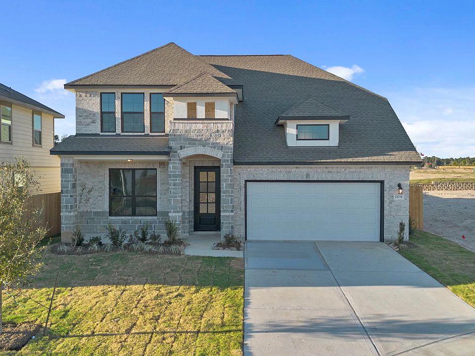 Welcome home to 24214 Dewey Trail located in the Spring Creek Trails Community and zoned to Magnolia