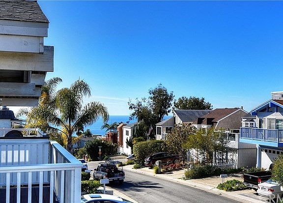 Front of home with peek ocean view.