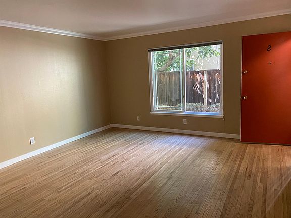 Inside Uint 2. Ground-floor unit facing large avocado tree.