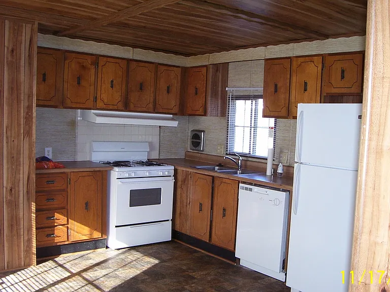 Kitchen -cooking range and vent hood -kitchen sink - dish washer - refrigerator/freezer