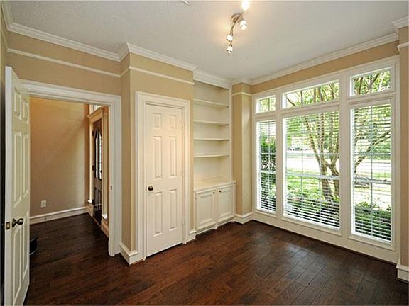 To the left of the entry foyer is a comfortable study with built-in bookcase and closet.