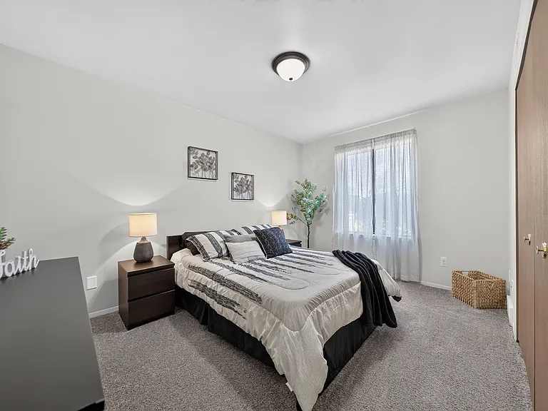 Spacious bedroom with ample storage space at Eastwood Village Apartments in Clinton Township, MI.