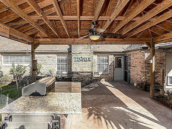 Awesome back patio with commercial grill hard-plumbed to gas!