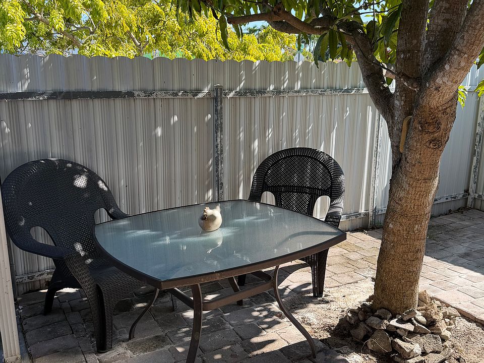 Patio area with a nice mango tree- yummy during mango season